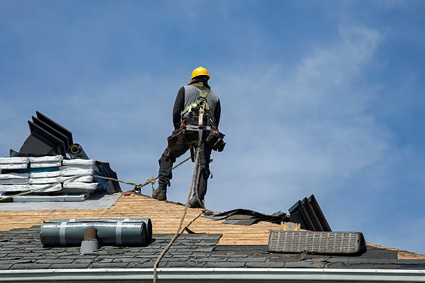 Professional Roof Replacement technician working in Bessemer, MI